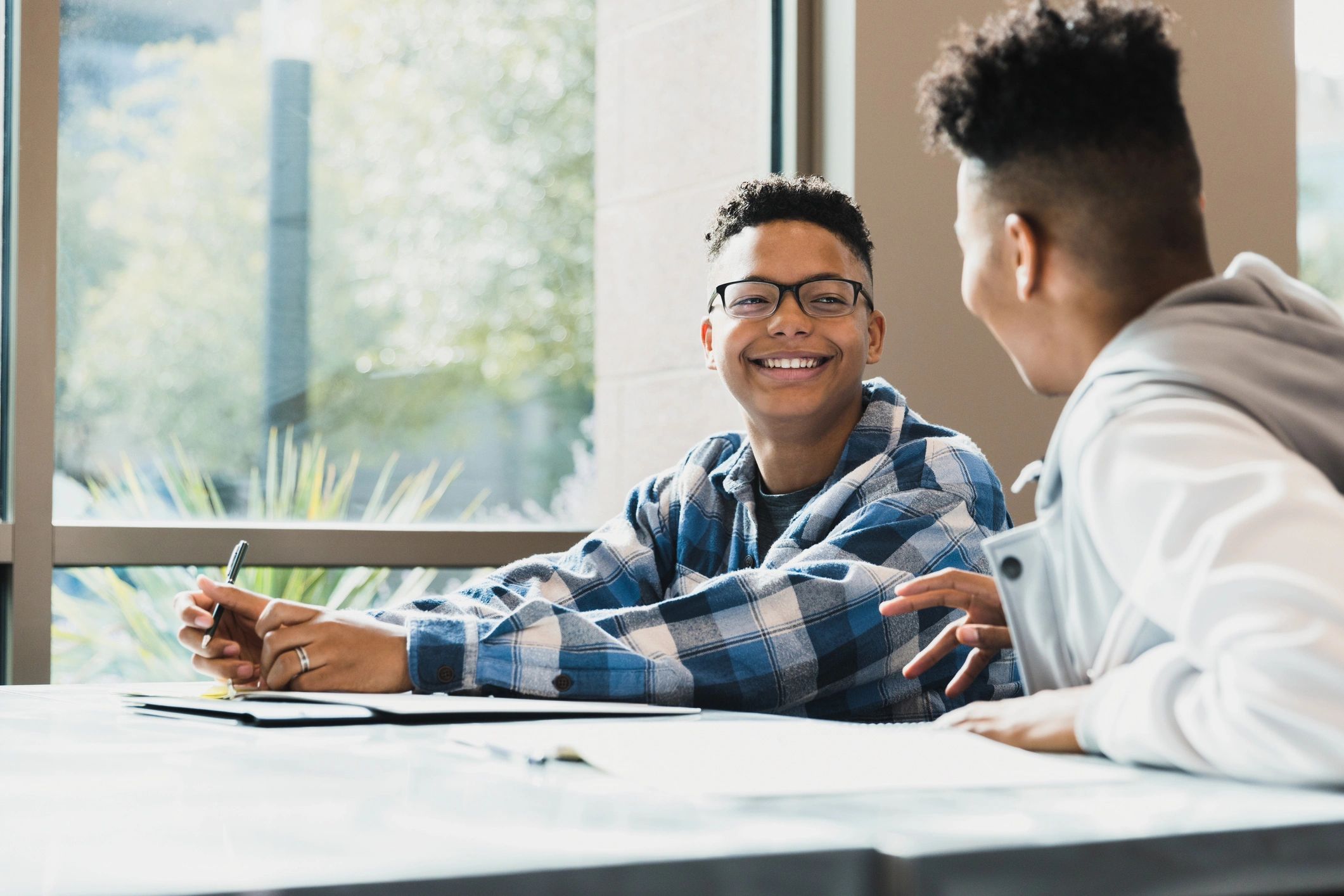 Friendly tutor supporting a student during a learning session